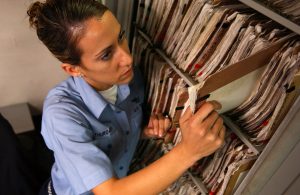041019-N-5821P-019
Yokosuka, Japan (Oct. 19, 2004) - Airman Lauren Thurgood of Las Vegas, Nev., pulls patient medical records in the inpatient ward aboard the conventionally powered aircraft carrier USS Kitty Hawk. Kitty Hawk's medical department services between 80 and 100 patients daily, providing around the clock, quality health care. Currently in port in Yokosuka, Japan, Kitty Hawk demonstrates power projection and sea control as the U.S. Navy's only forward-deployed aircraft carrier. U.S. Navy photo by Photographer's Mate 3rd Class Jason T. Poplin (RELEASED)